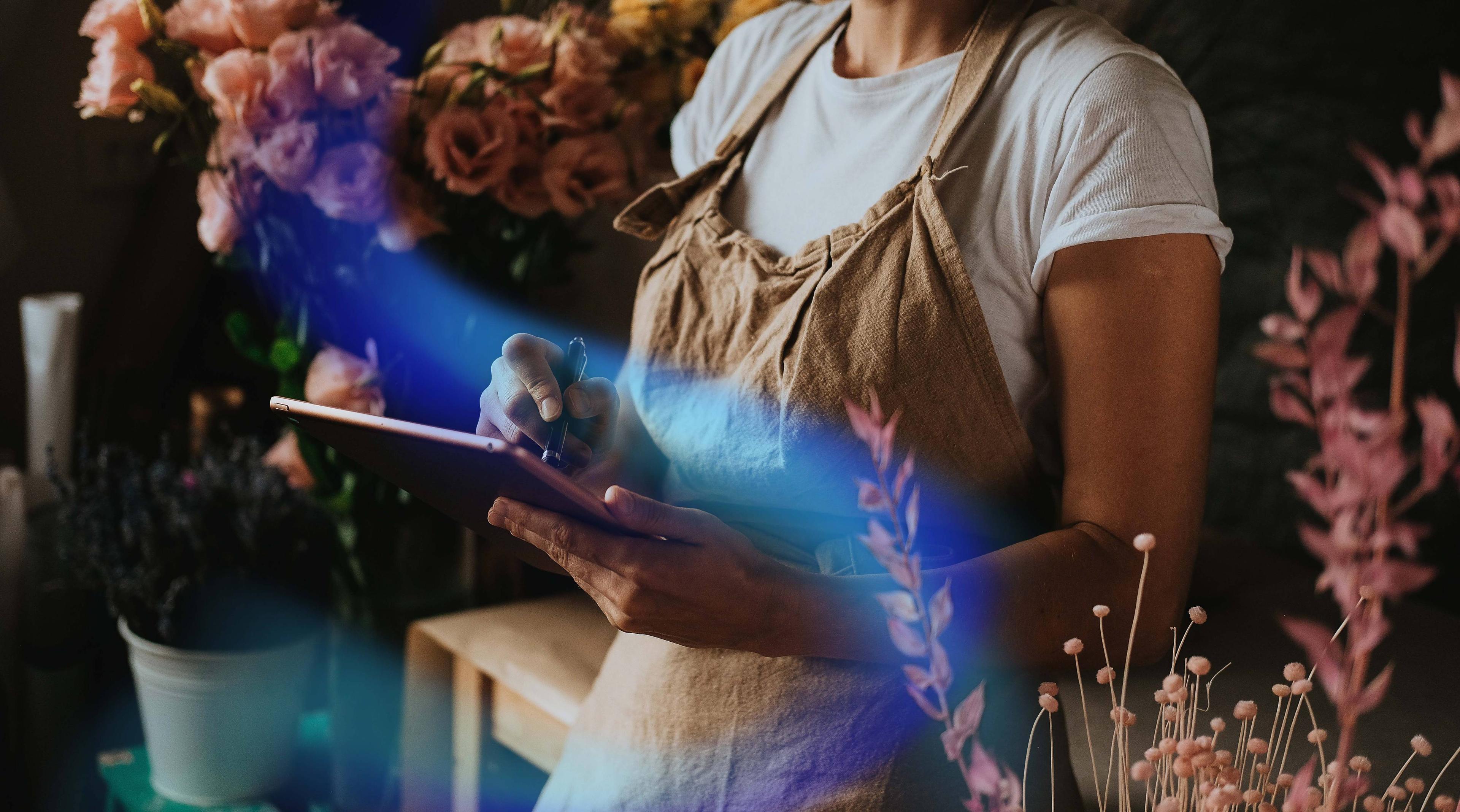 Woman writing on a digital tablet